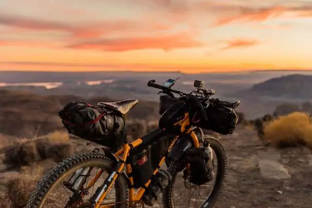 Mountain bike equipped with food, water, tent and other safety essentials