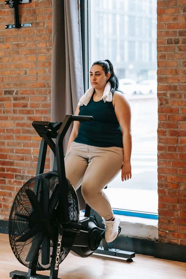 Woman relaxing on an exercise bike