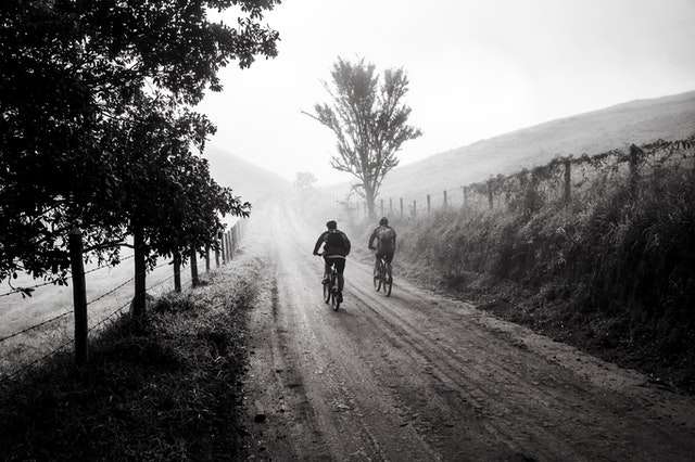 Black and white photo of two mountain bikers