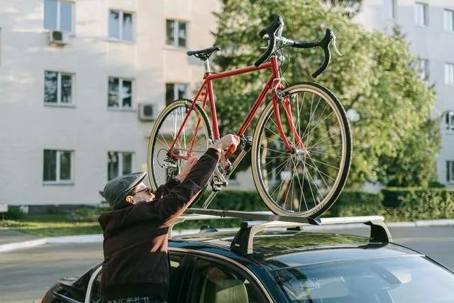 Red bicycle mounted on roof rack