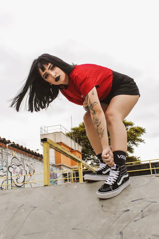 woman wearing vans shoes at skatepark