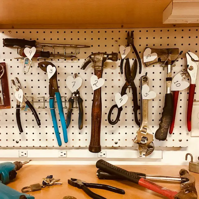 Workbench showing handheld tools like pliers, and screwdrivers