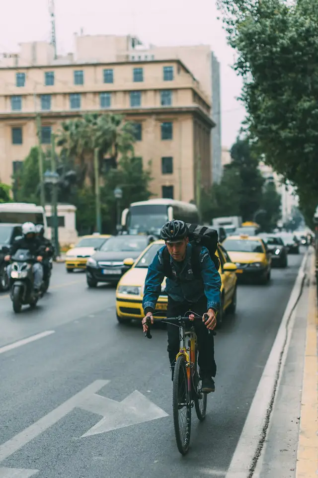 commuter riding road bike in traffic
