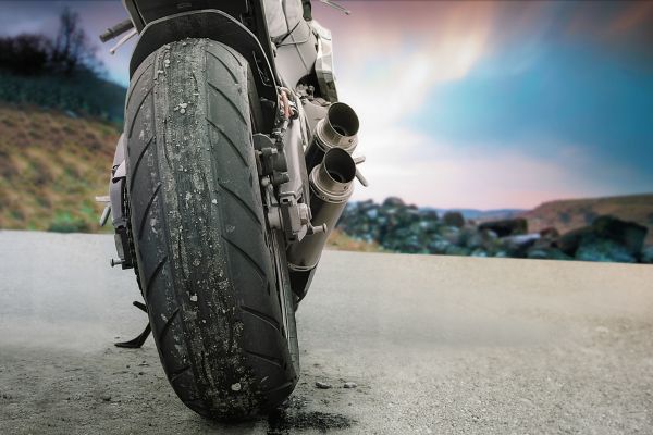 rear of motorcycle tire showing exhaust