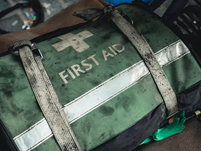 worn out green first aid kitbag